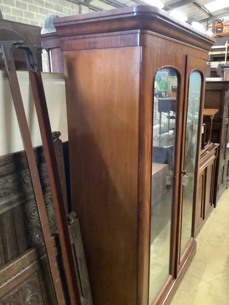 A Victorian mahogany mirrored two door wardrobe, width 142cm depth 60cm height 208cm